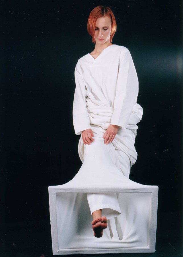 Konstantin Grouss in Intuition of Form, 2003 — a figure in a white sculptural costume. Photo by Elena Potyeva