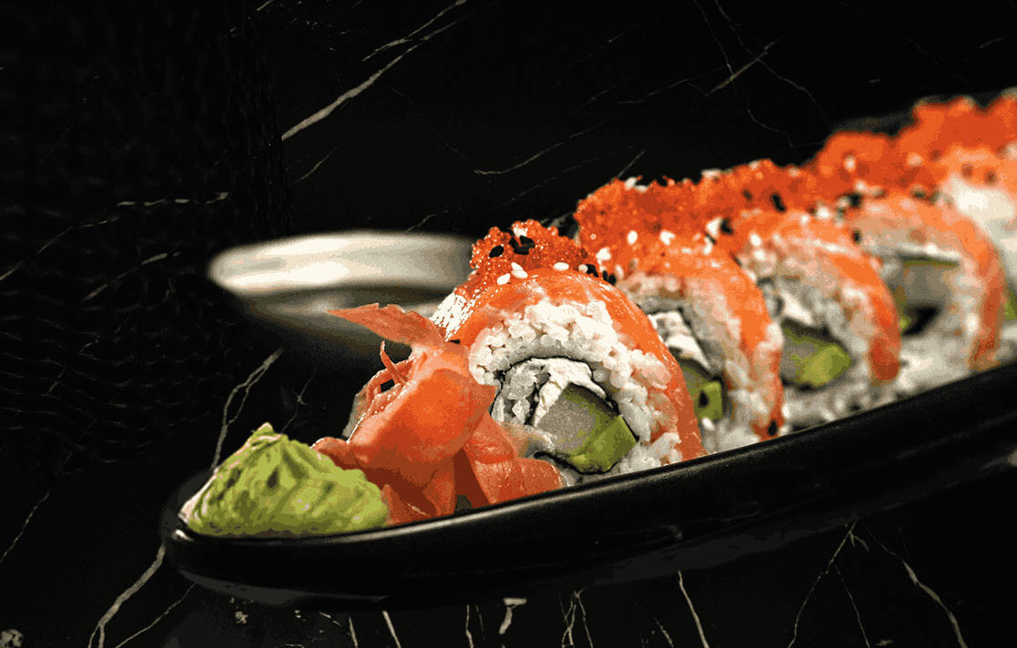 Close-up of fresh salmon sushi rolls, offering a great Western-Asian fusion option for seekers of halal food in Ubud.
