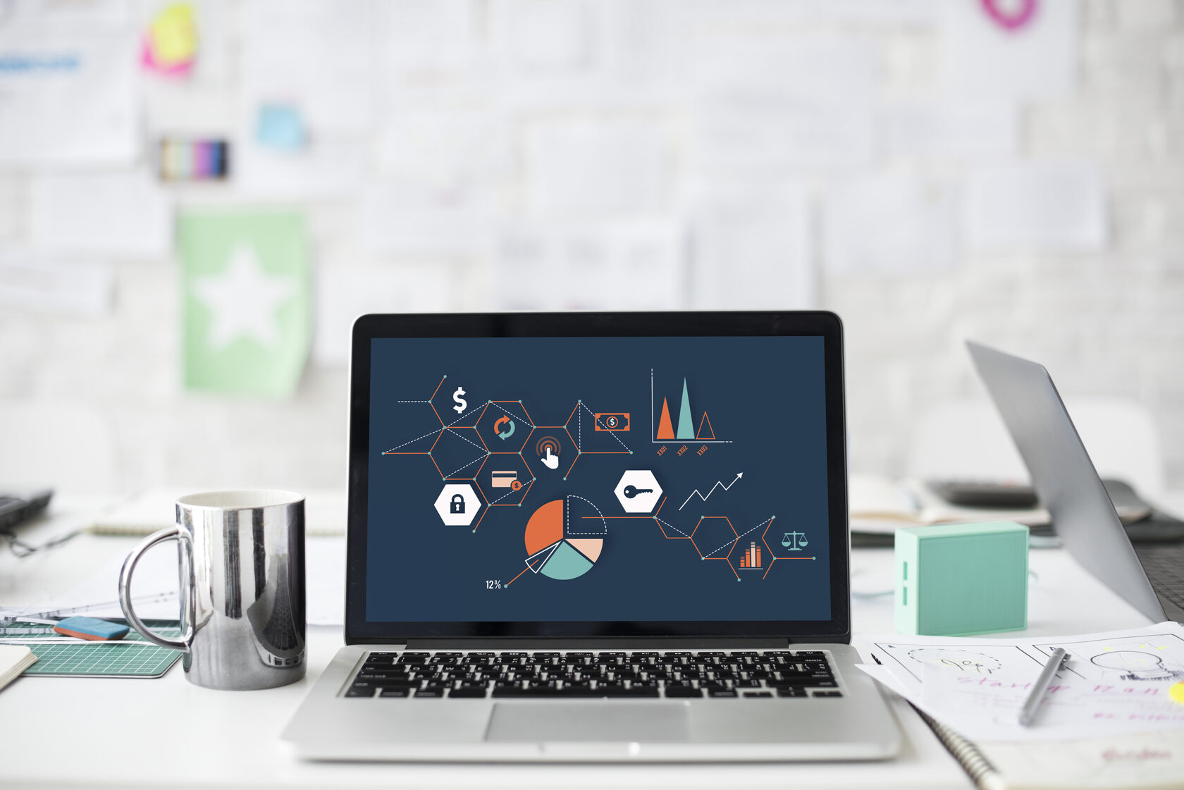 Laptop with the image of growth graphs and charts