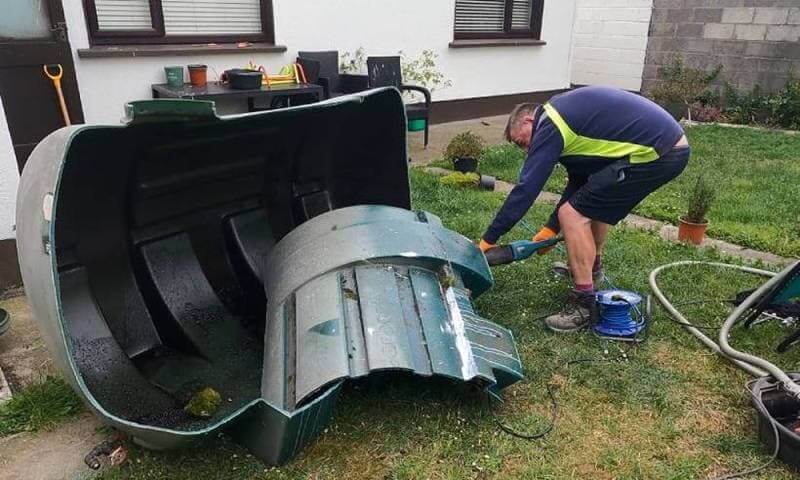 Old domestic oil tank removed during oil tank replacement with disposal included