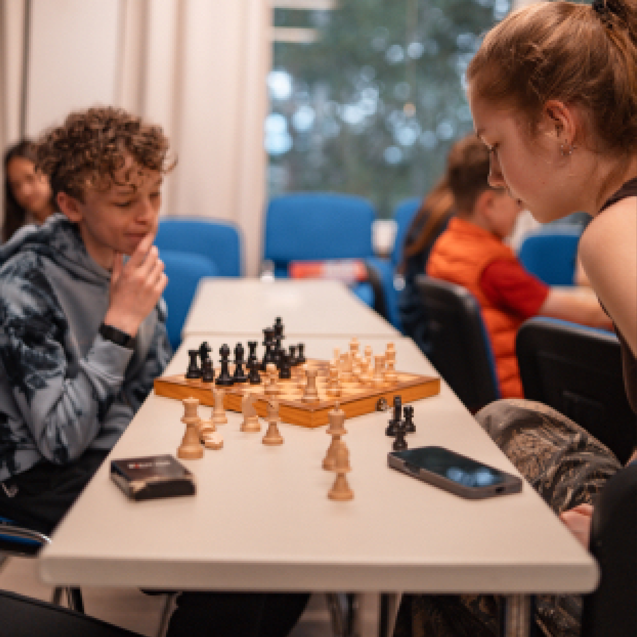 Two campers playing a strategy game