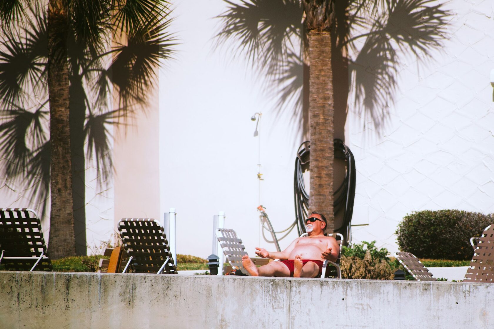 Relaxed man on lounge chair at resort