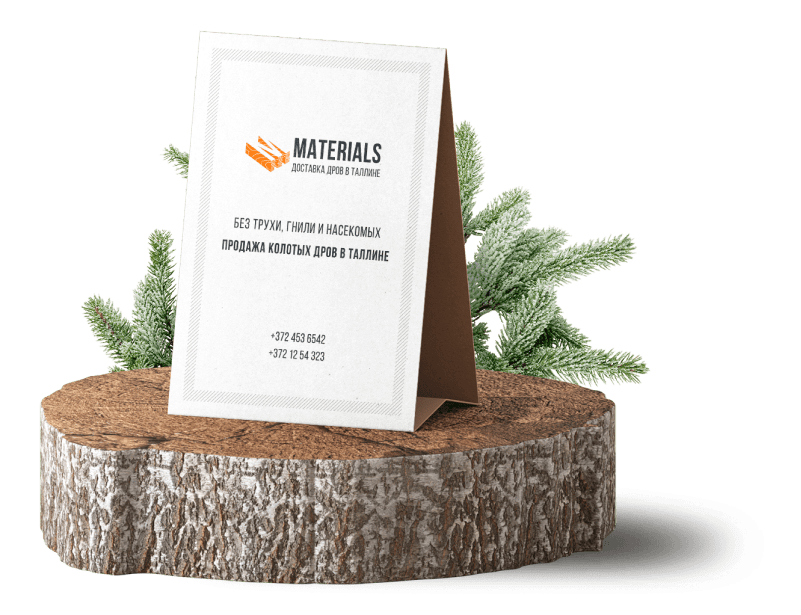 Карточка с контактами стоит на срезе дерева