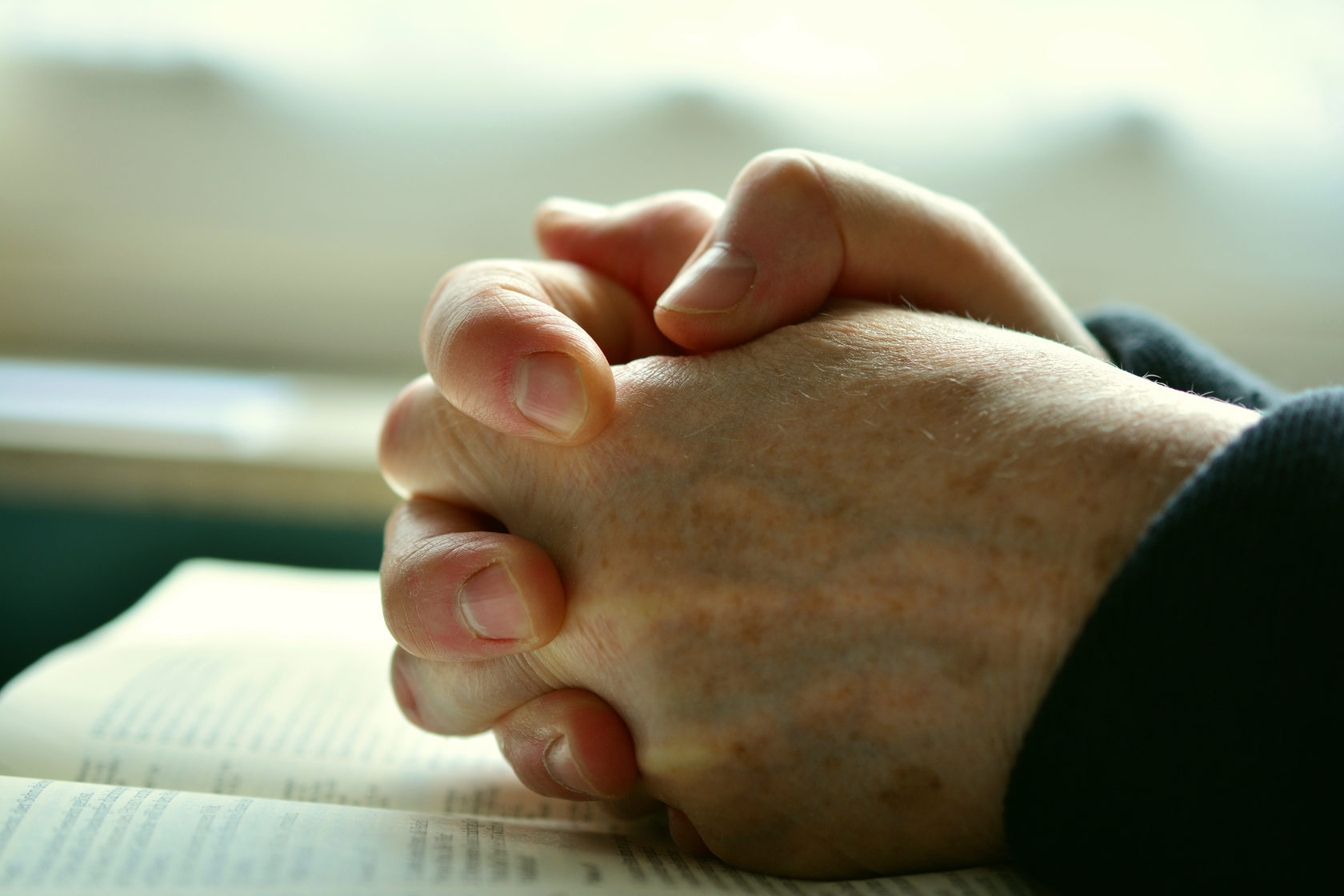 Prayer, clasped hands