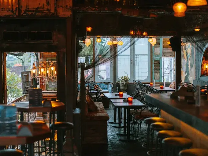 The unpretentious, vintage-inspired interior and balcony seating at No Más, a classic dive spot and a late-night favorite among the best bars in Bali.