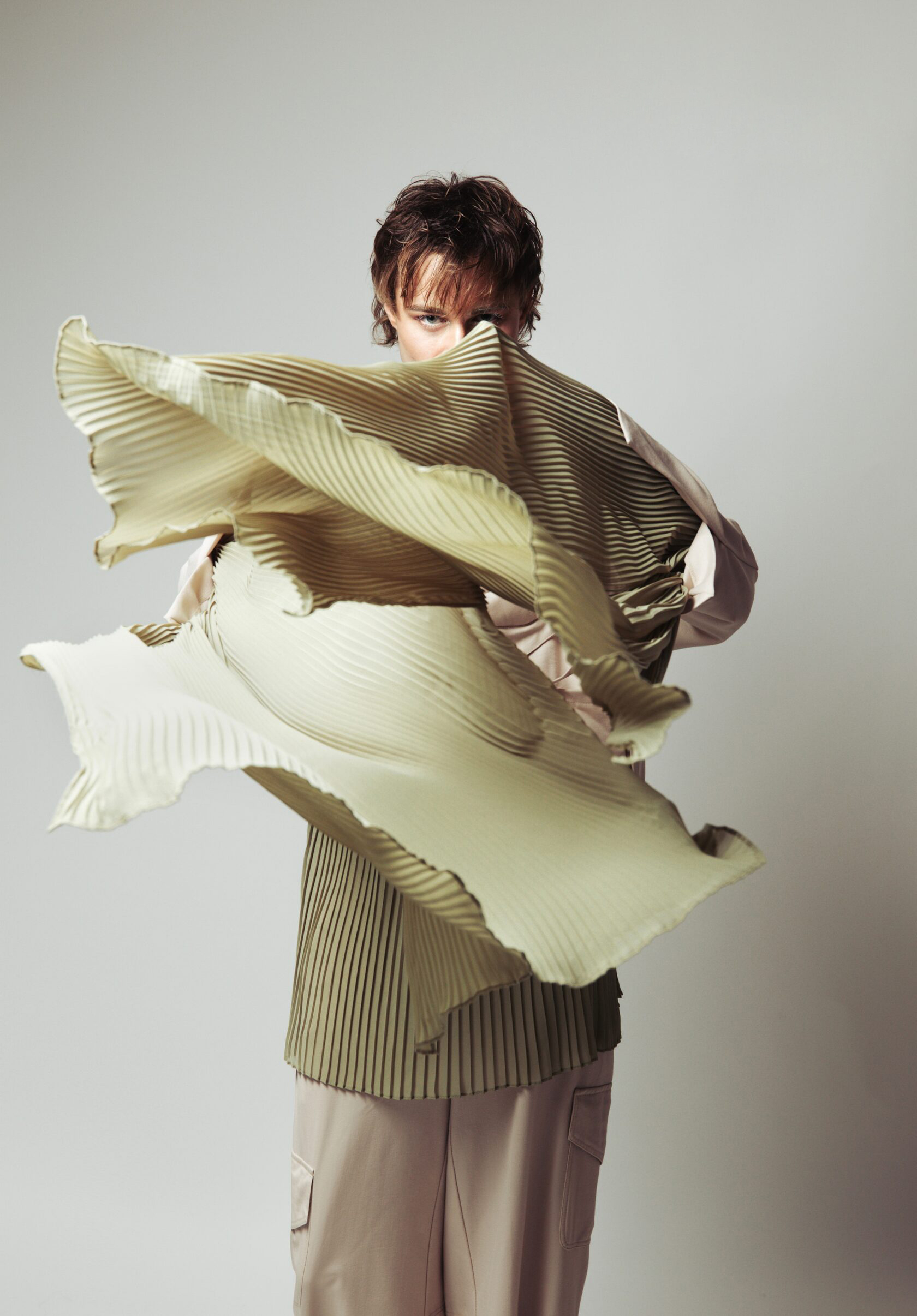 Artells Magazine fashion editorial with sculptural pleated clothing