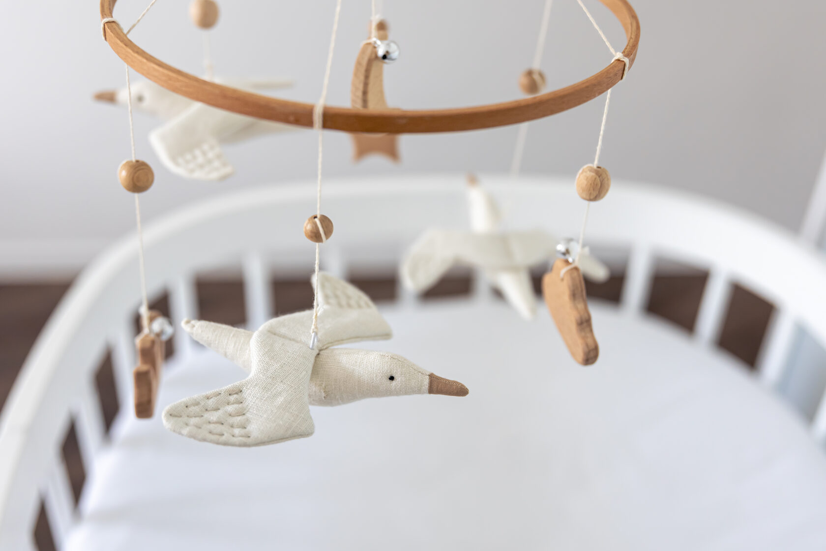 Handmade baby crib mobile, creating a soothing sleep environment for newborns.