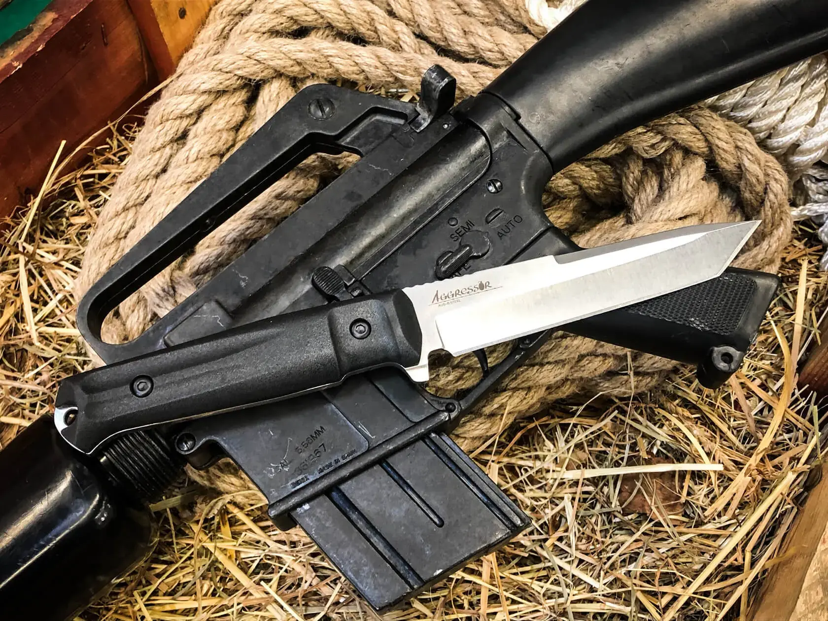 Aggressor working knife shown with field equipment