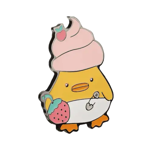 значок в виде утки с кремом