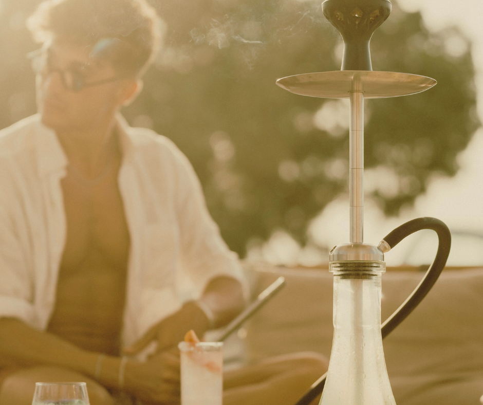 a man with shisha device at seminyak beach