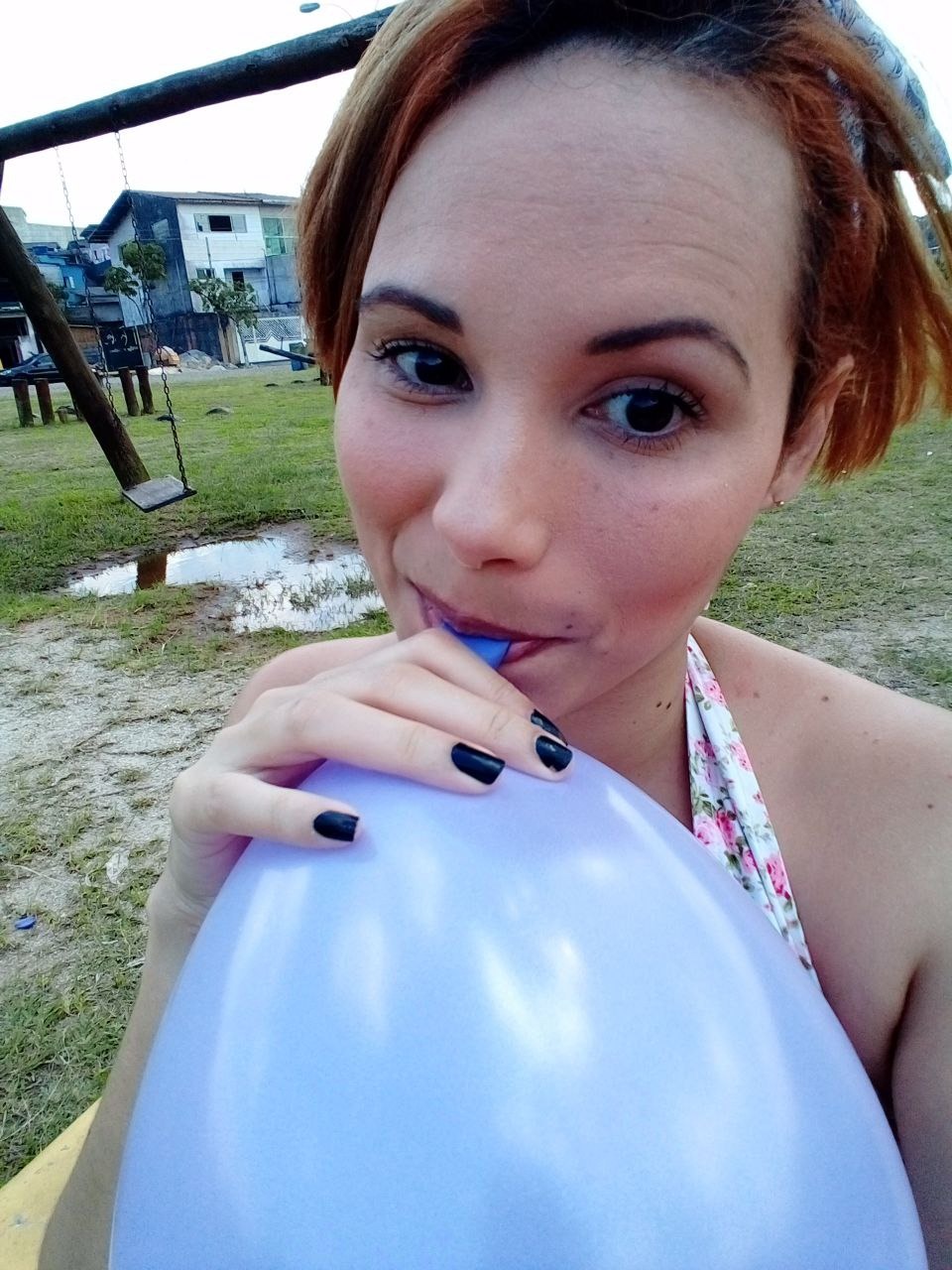 Blowing balloons outside