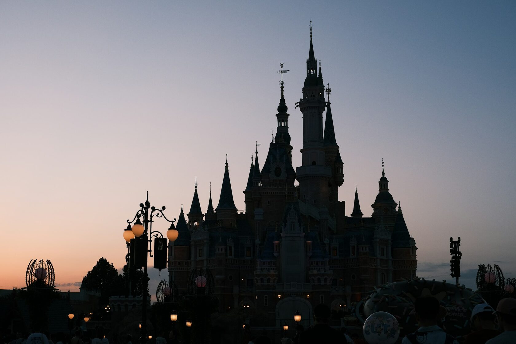 Shanghai Disneyland Enchanted Storybook Castle illuminated at night
