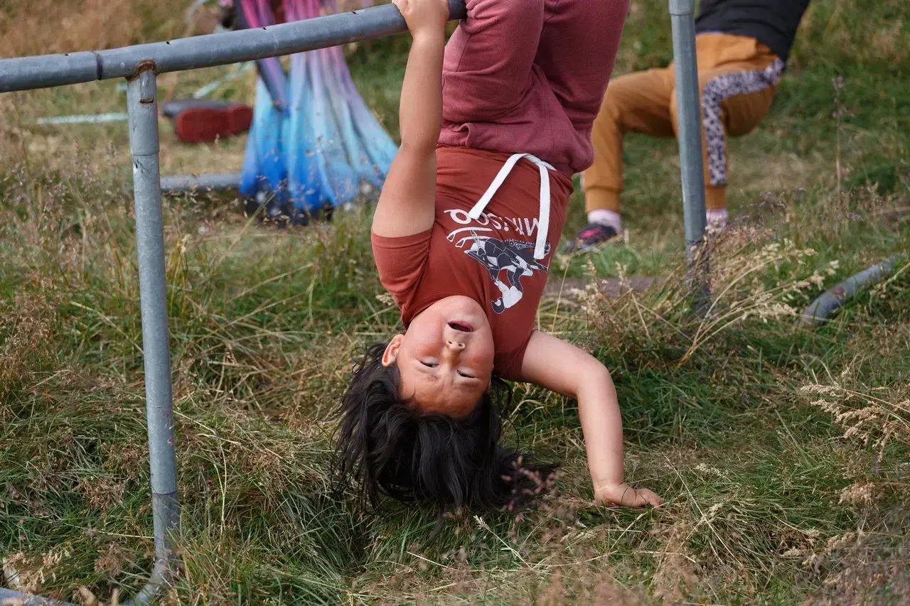 A local Inuit child playing outdoors in an East Greenland settlement offering a glimpse into everyday life in one of the worlds most remote Arctic communities. Encounters like these provide an authentic cultural experience alongside the breathtaking lands