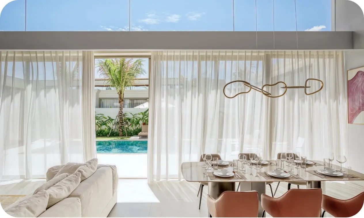 Bright living area at Asherah Villa overlooking the pool