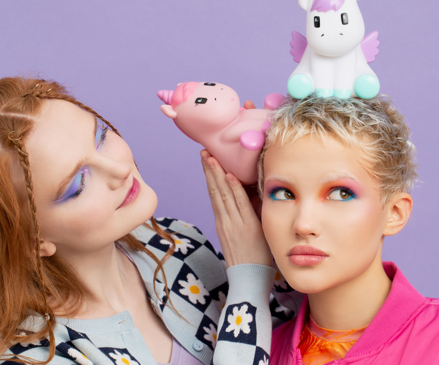 Two girls with unicorns toys