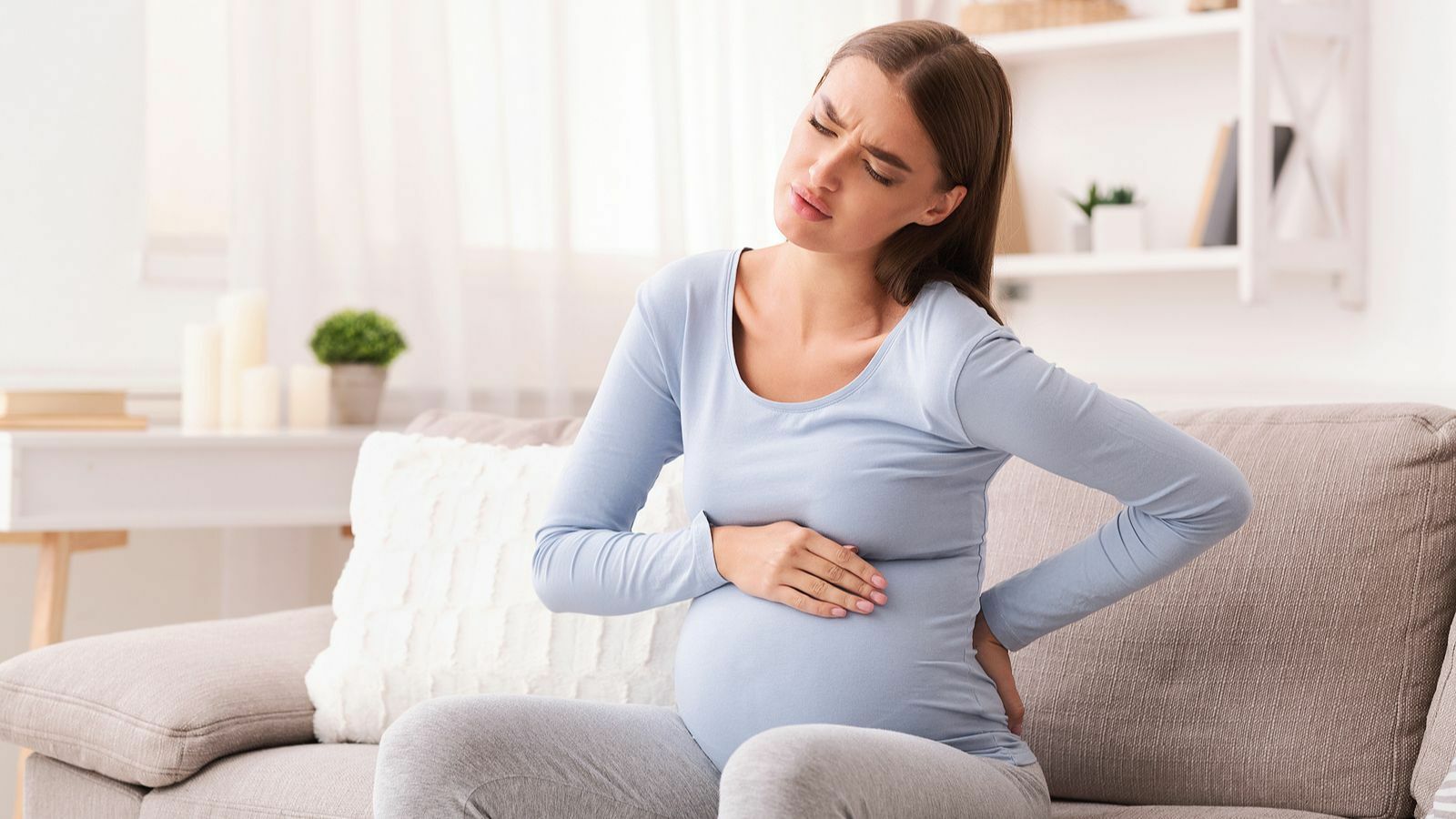 Симптомы боли в пояснице на ранних сроках беременности