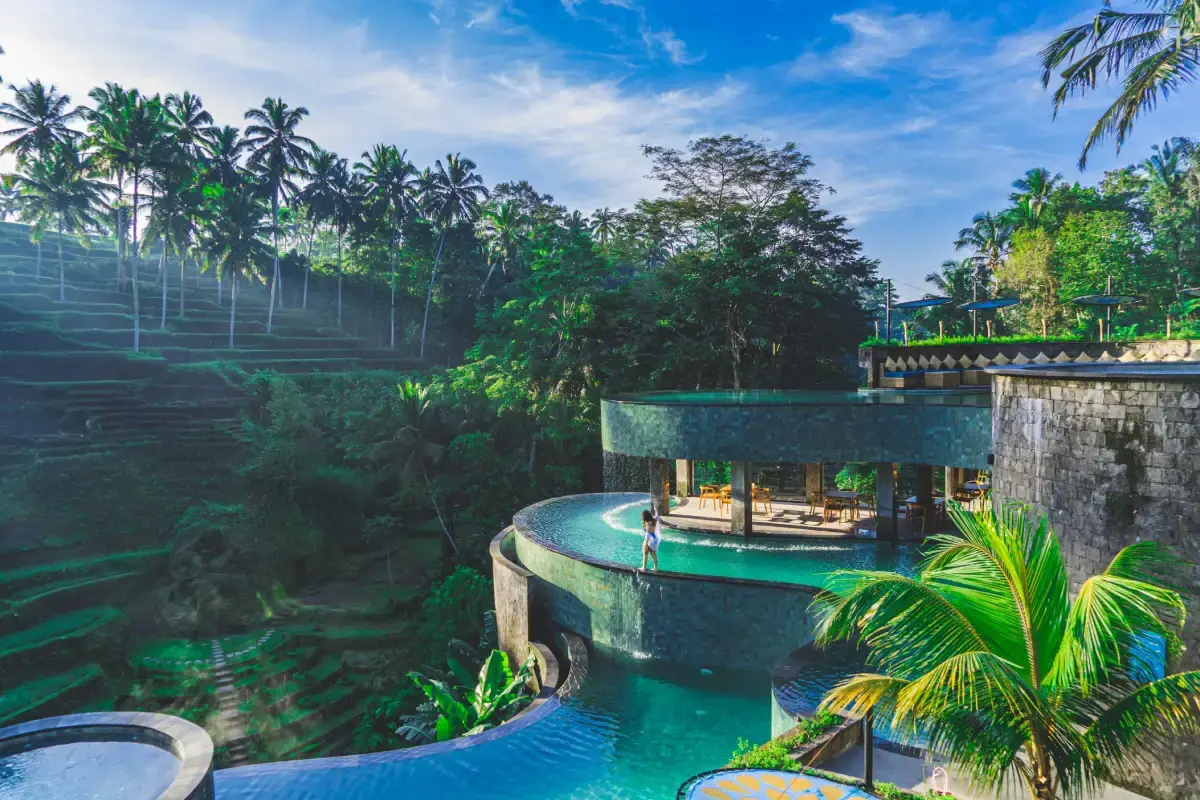 Stunning multi-tiered infinity pools overlooking spectacular emerald rice terraces at Cretya Ubud, a luxurious day club to add to your Ubud getaway itinerary.