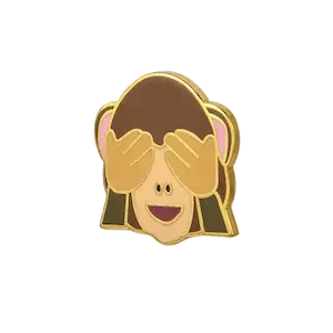 металлический значок с изображением обезьяны