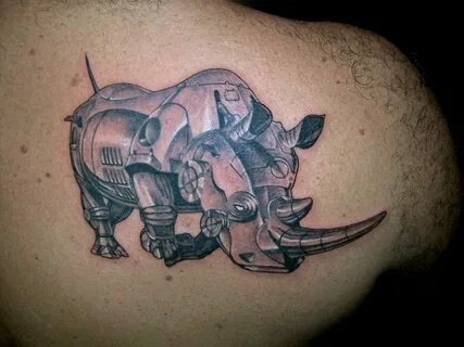Носорог тату: мощный символ силы