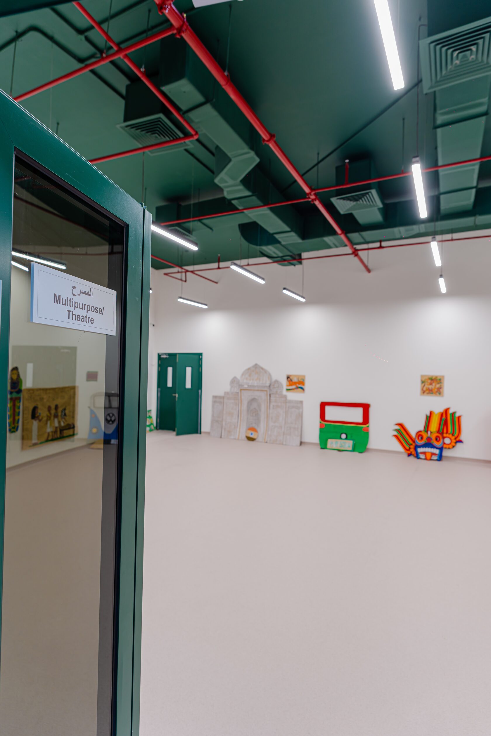 Children performing in the theatre hall at Paddington Park nursery Dubai