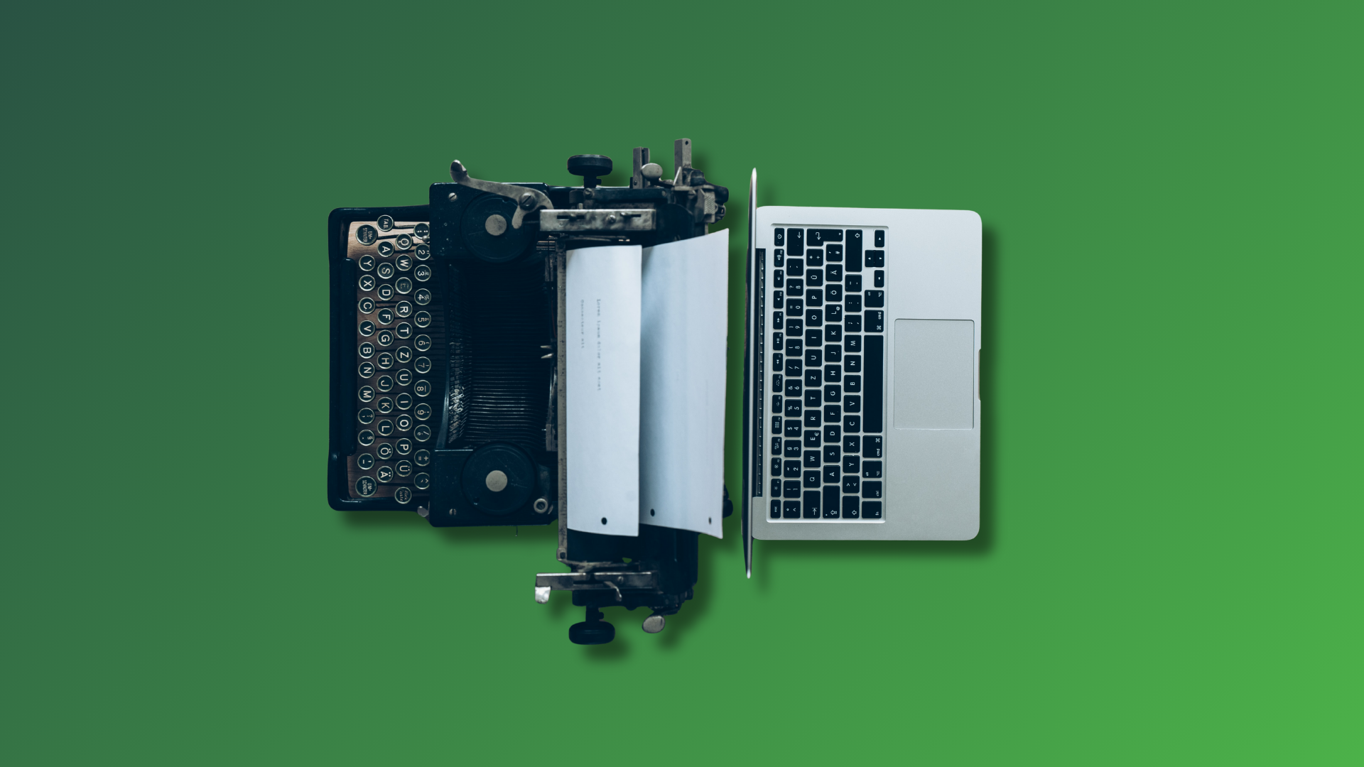 an old type writer and a new computer