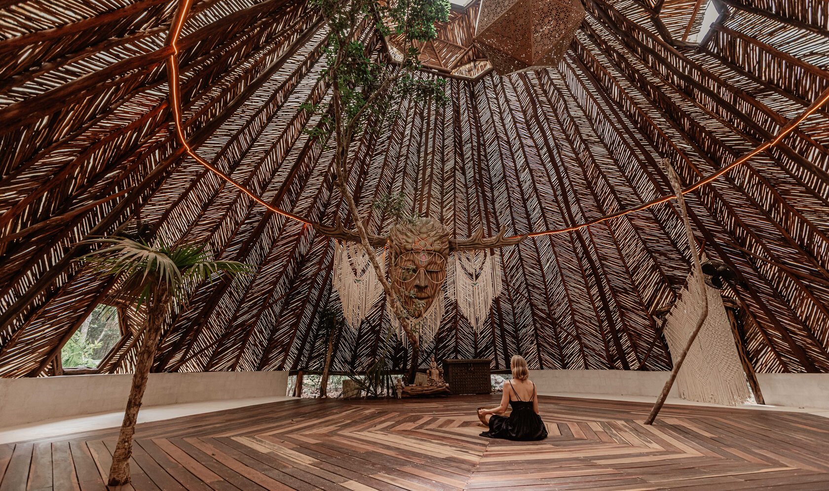Yoga and meditation space inside a wooden jungle pavilion in Tulum