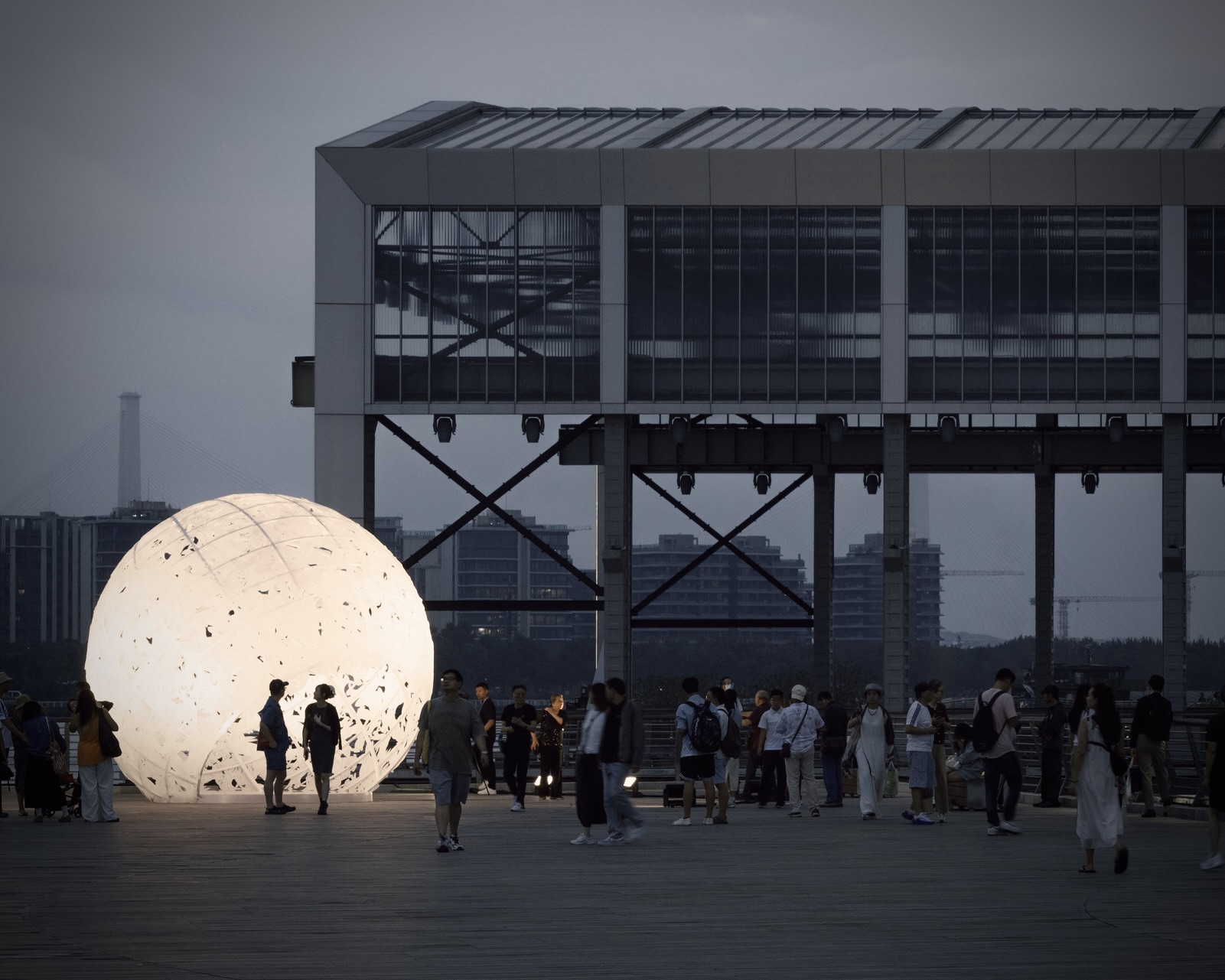 GORK The Full Moon: glowing sphere on Shanghai’s waterfront at dusk