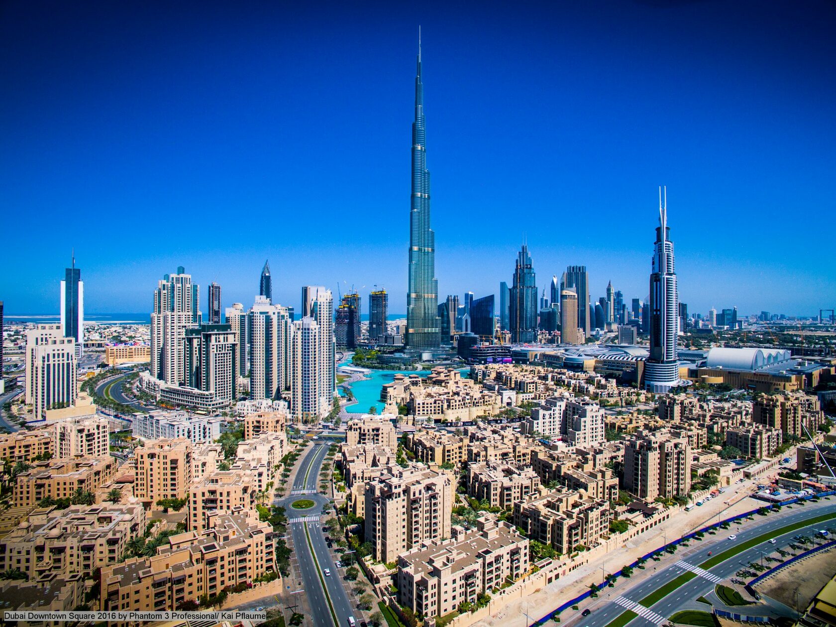 Ели дубай. Даунтаун Бурдж Дубай. Район Downtown Дубай. Downtown Dubai о районе. Бурдж Халифа даун Таун.