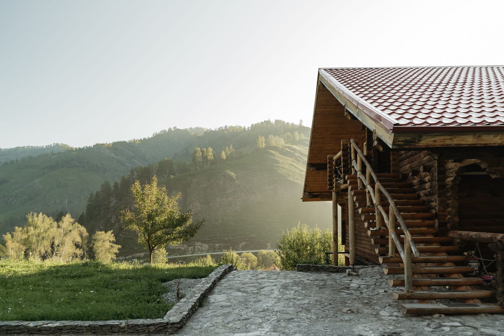 Log cabin exterior with red roof