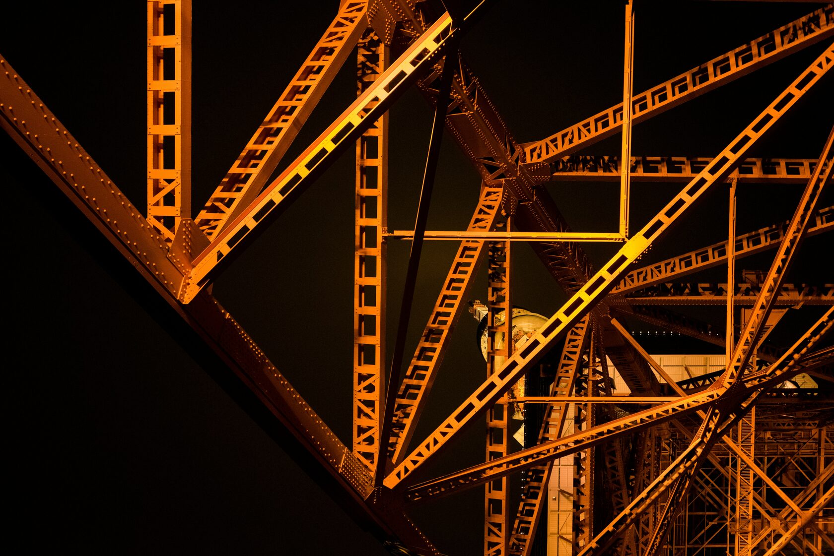 Eiffel Tower structural detail at night in golden light