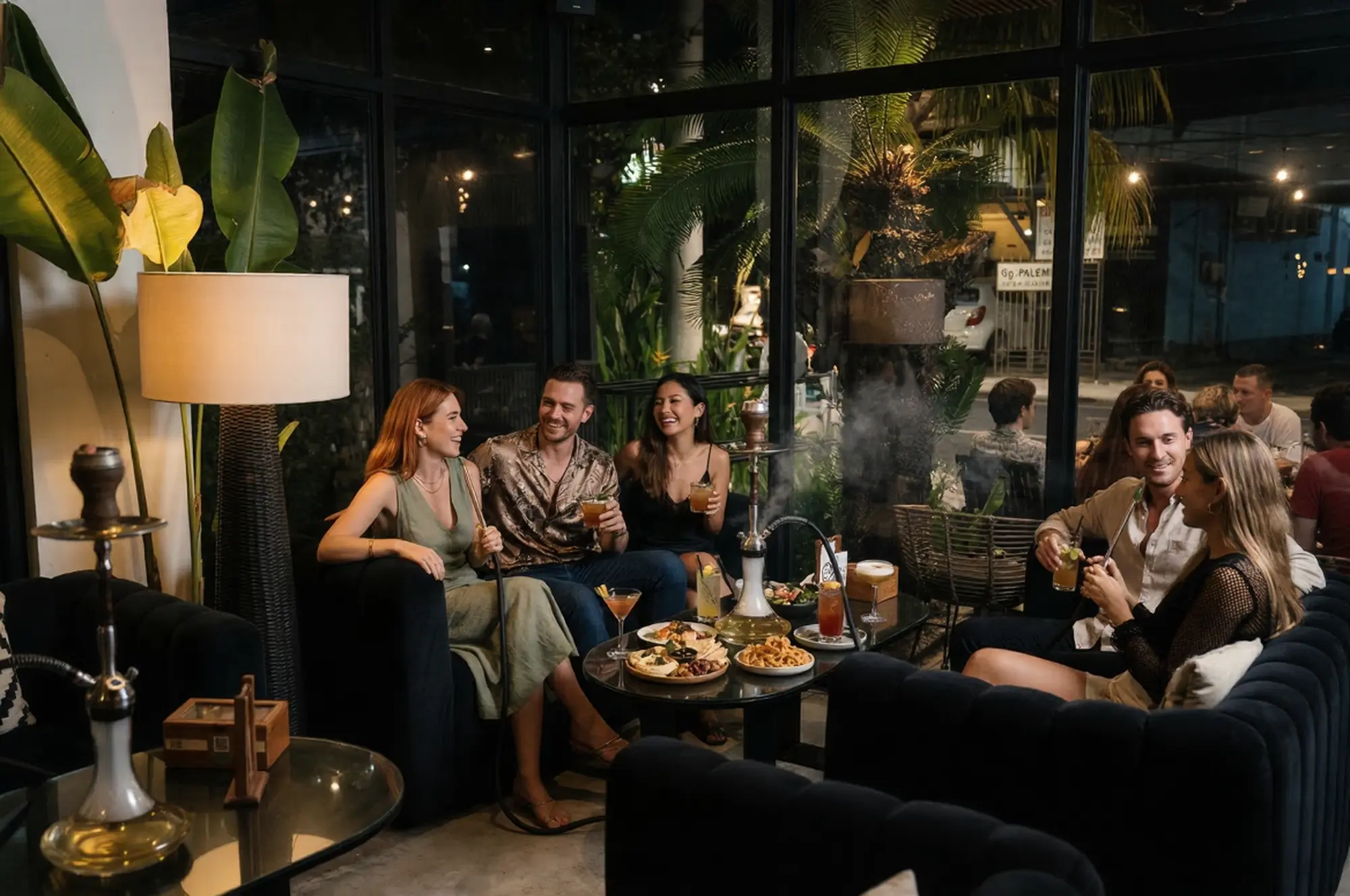 A stylish group of friends enjoying premium hookah, drinks, and late-night conversation at Eden Hookah Club Canggu, one of the best bars in Bali for a relaxed evening.