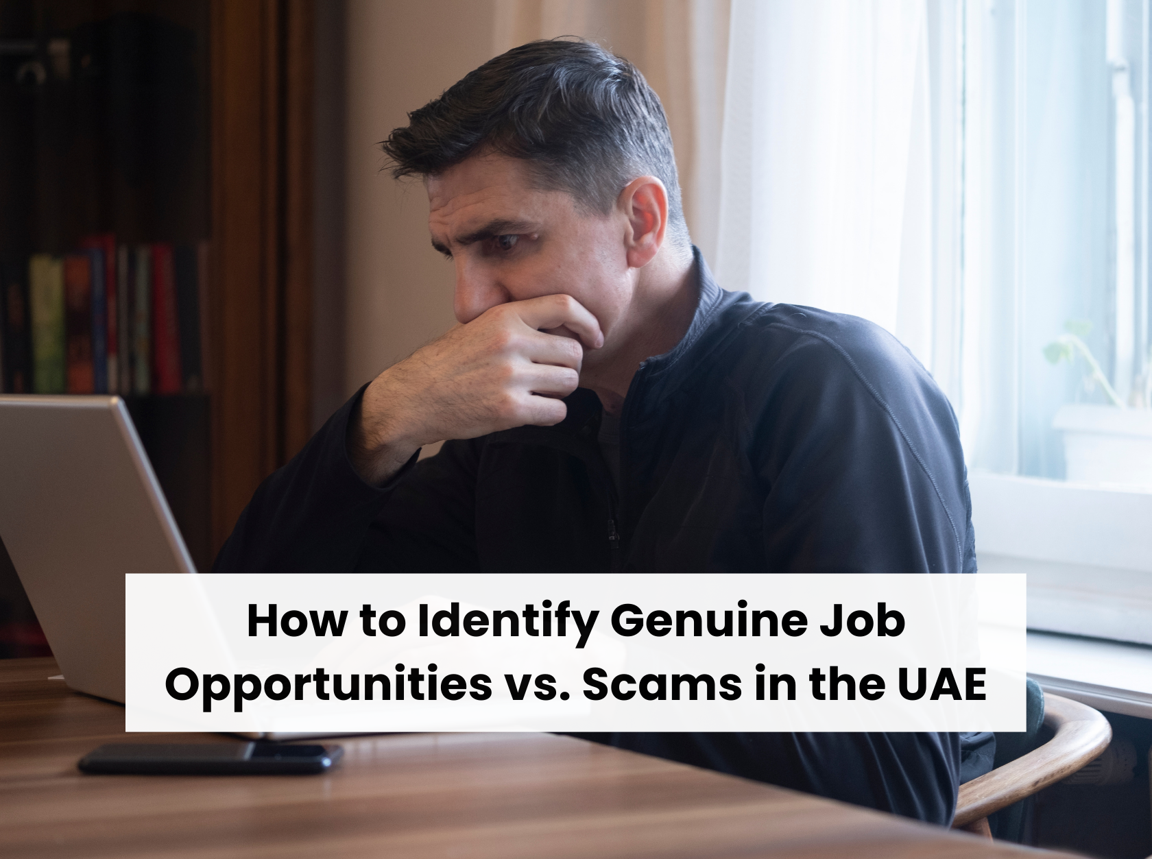 Job seeker assessing online job opportunities on a laptop during UAE job search