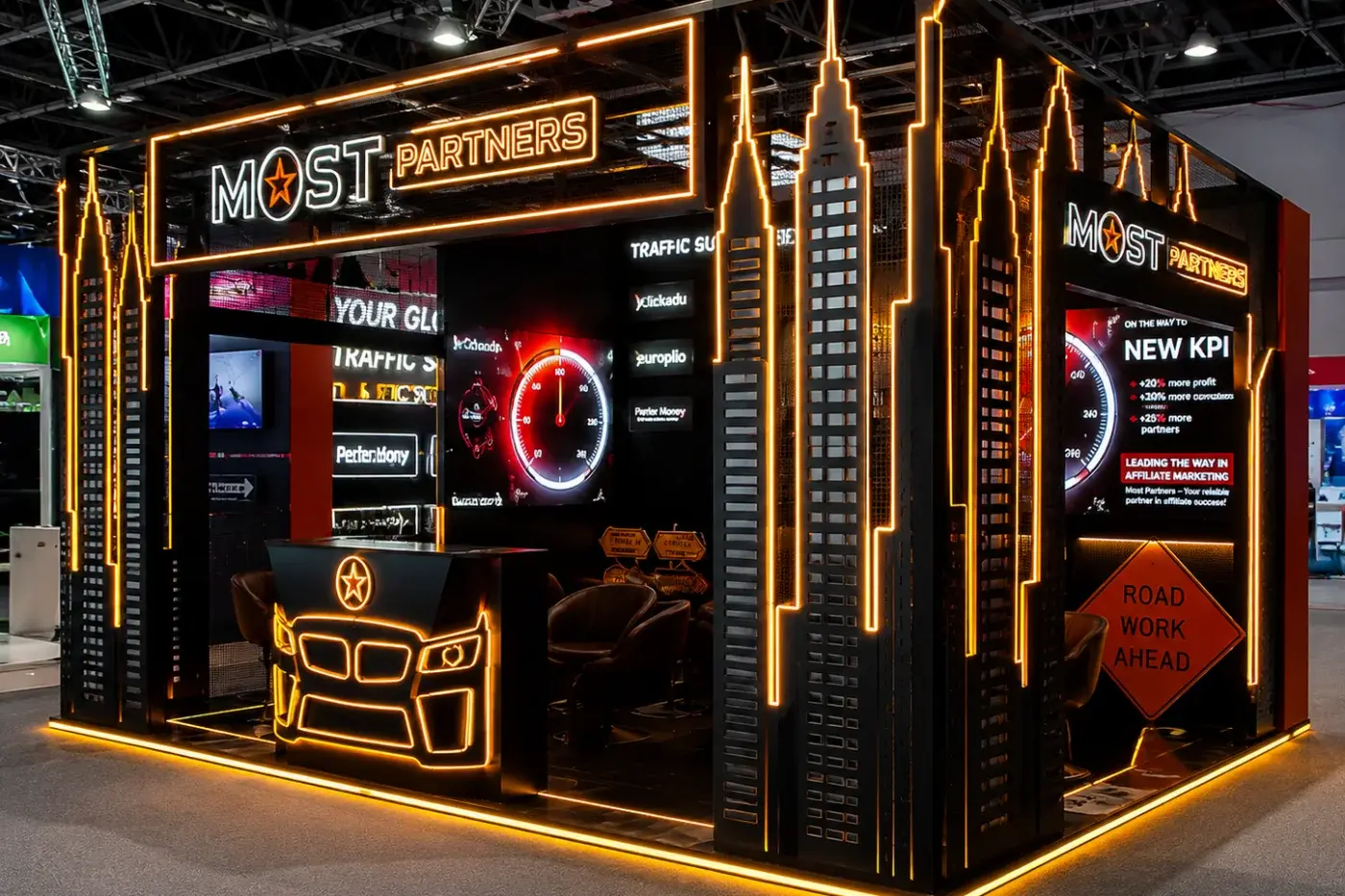 Themed stand with gold columns and a feature lighting rig