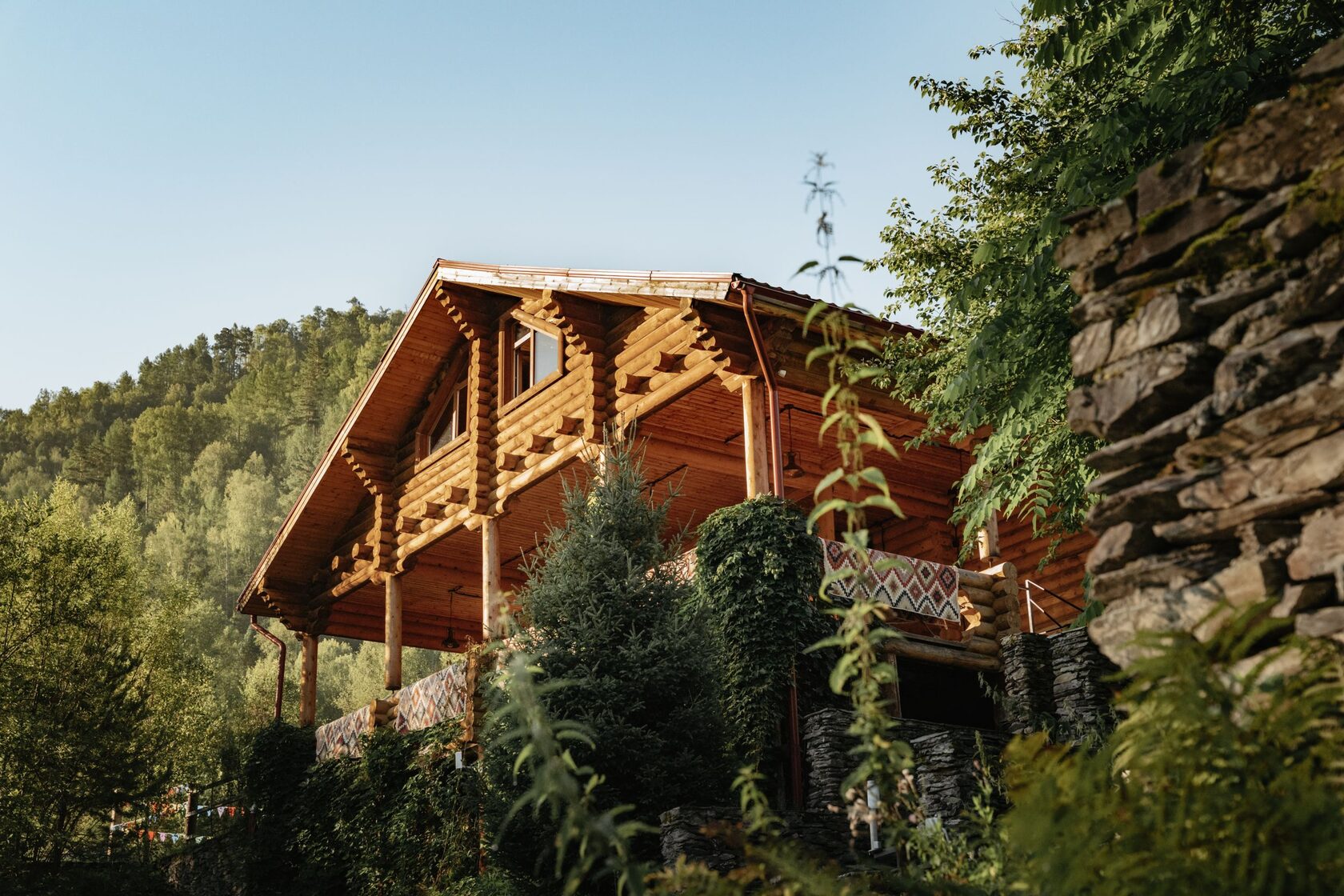 Two-storey log chalet with kilim railing