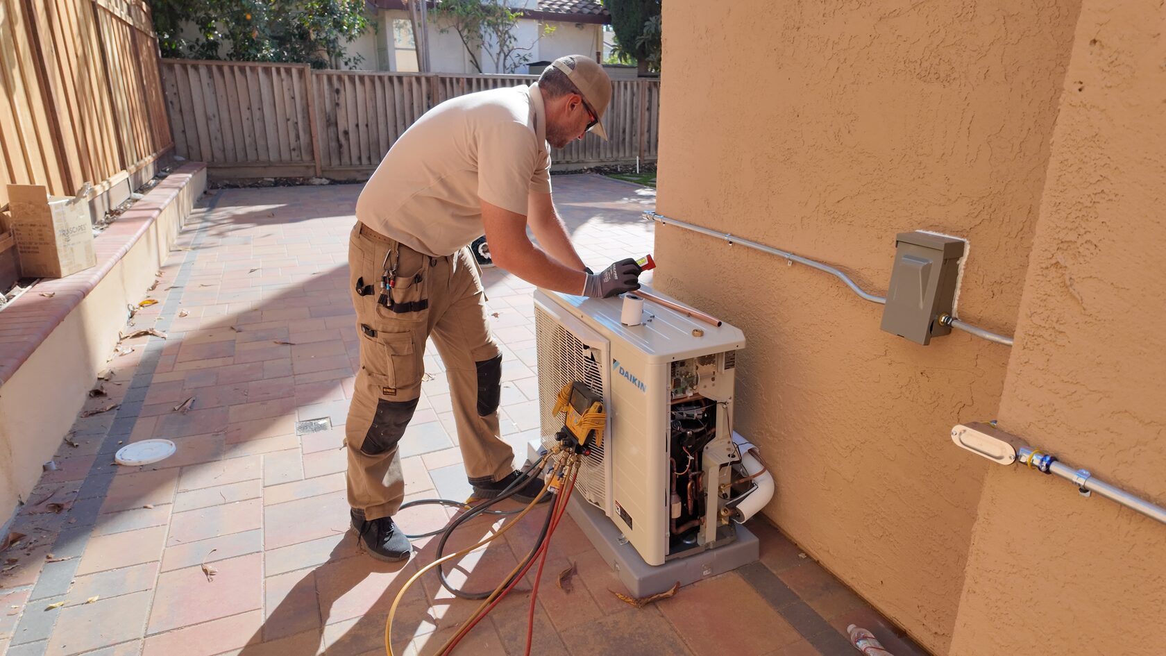technician examines electric furnace vs heat pump in real life