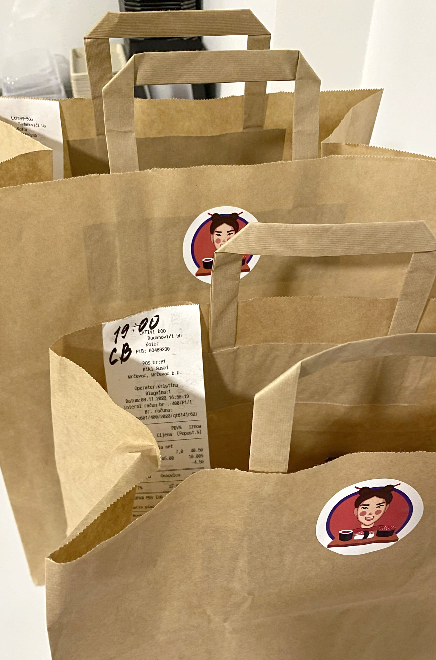 Kiki Sushi branded paper packet designed for takeaway orders