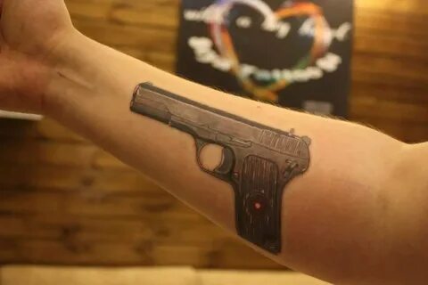 Что означает тату пистолет?