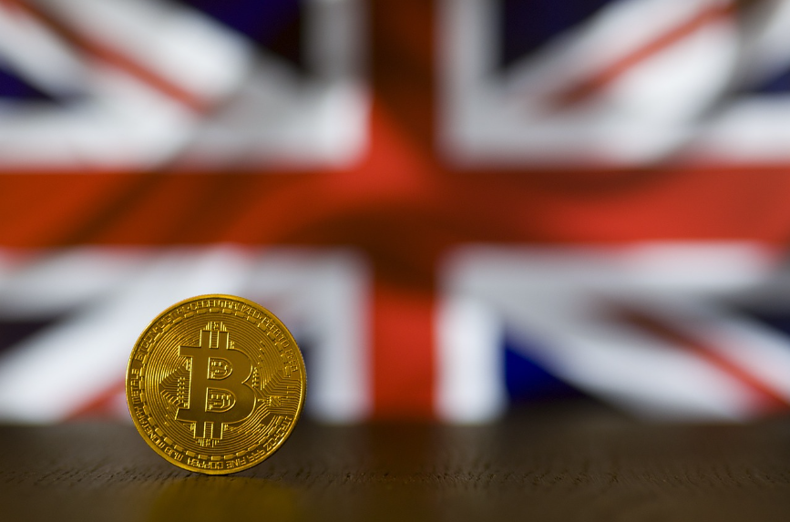 Binance halts UK customer deposits: Photograph of the UK flag and a Bitcoin