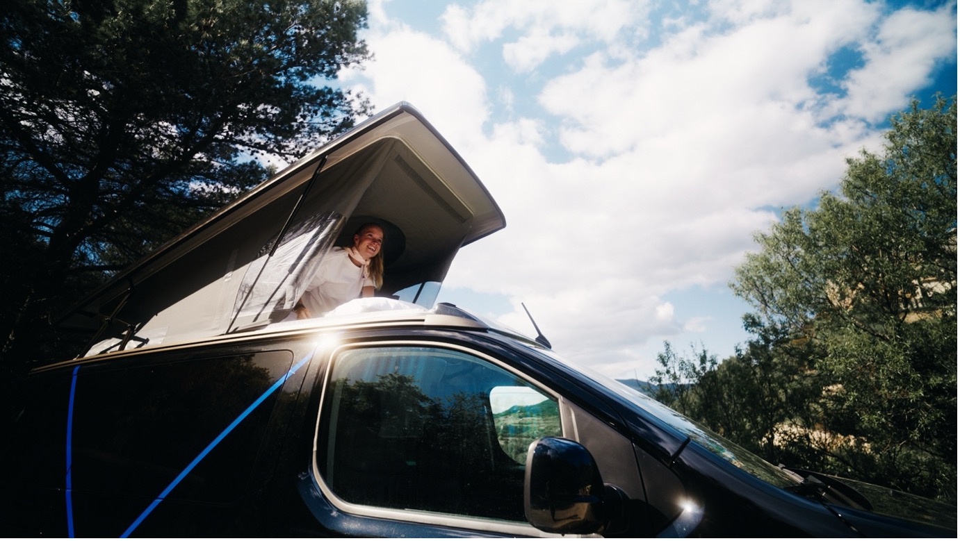 A person sitting in a van
AI-generated content may be incorrect.