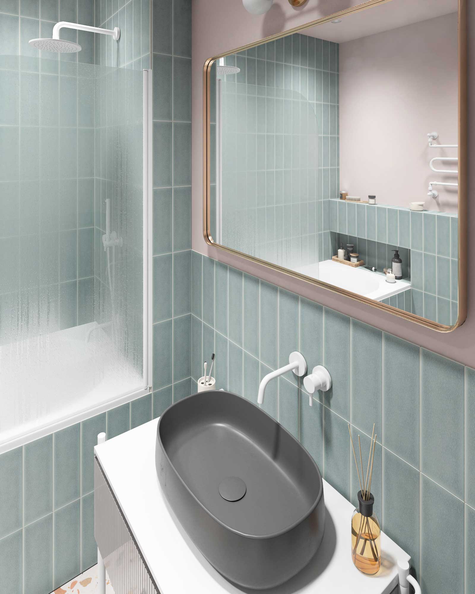 Серая раковина со встроенными смесителем из стены белого цвета. Зеркало с золотой рамой.