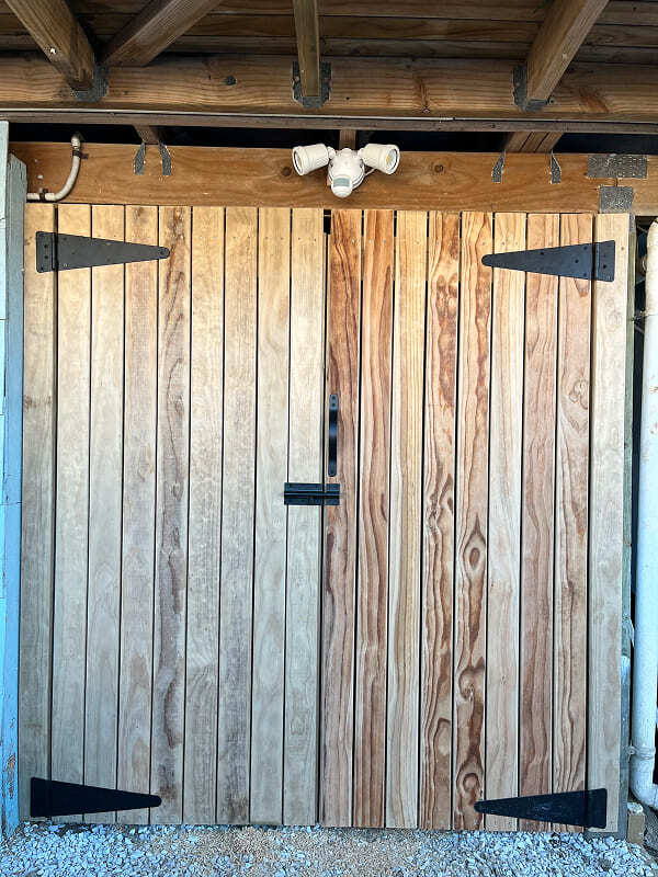 Custom-built under-deck storage door, installed on site