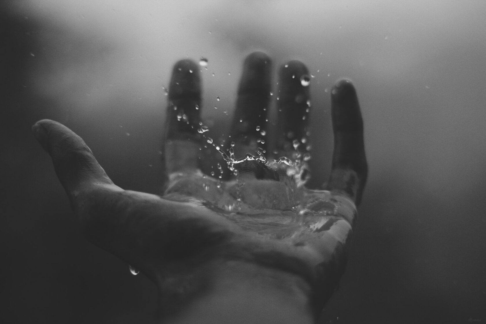 Water on hands and skin — a quieter kind of weather.