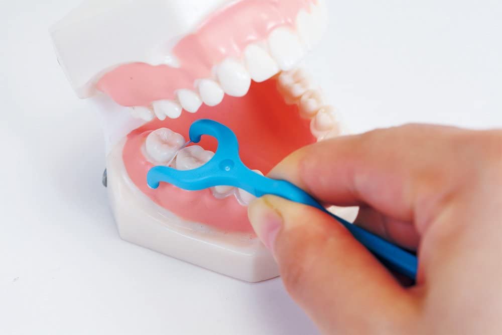 как пользоваться зубной нитью