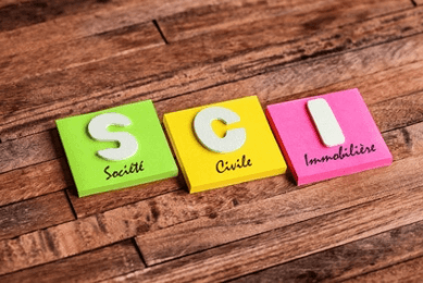 A visual representation with colorful cubes on a table spelling out letters.