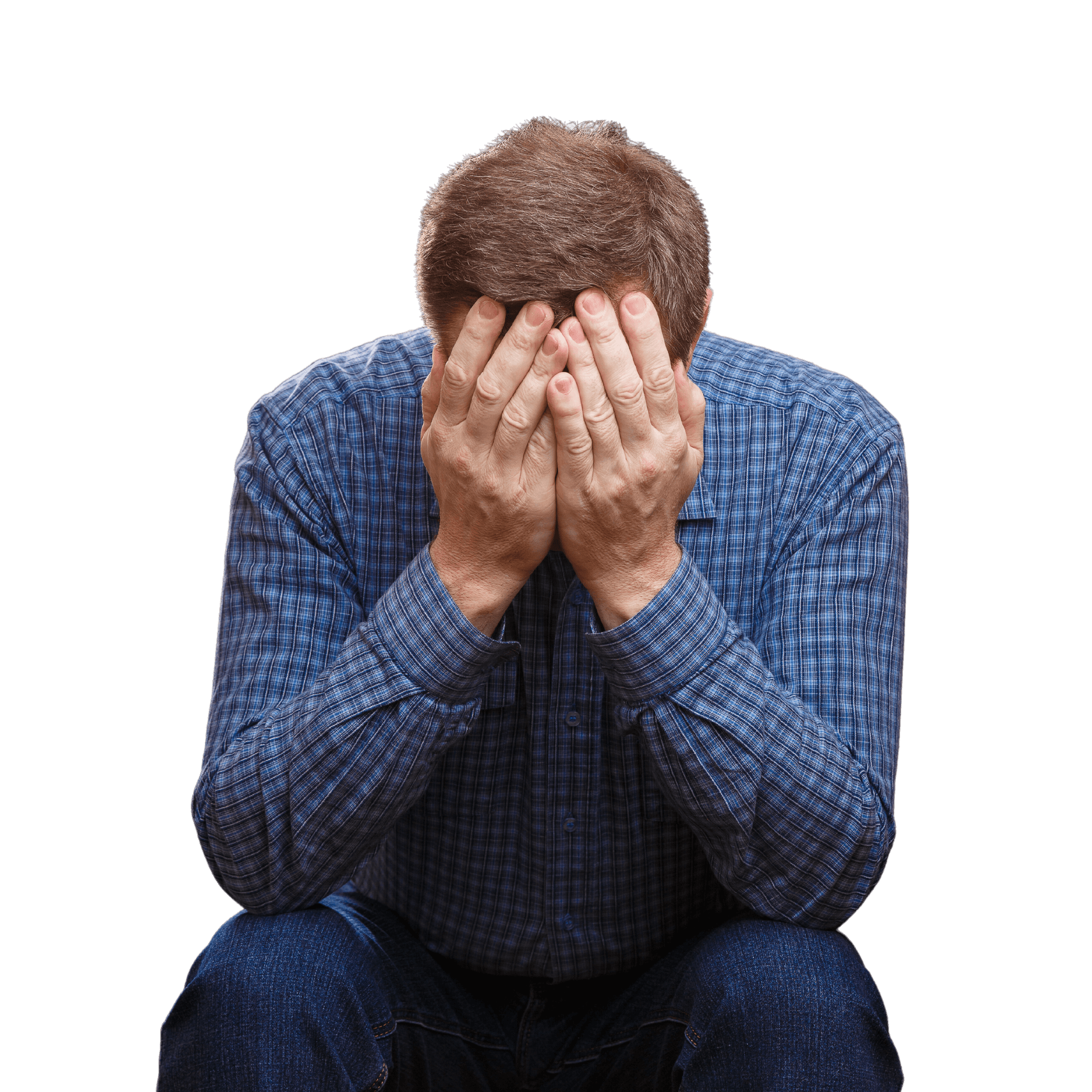Мужчина, находящийся в стрессе от долгов и закрывающий лицо руками. 
