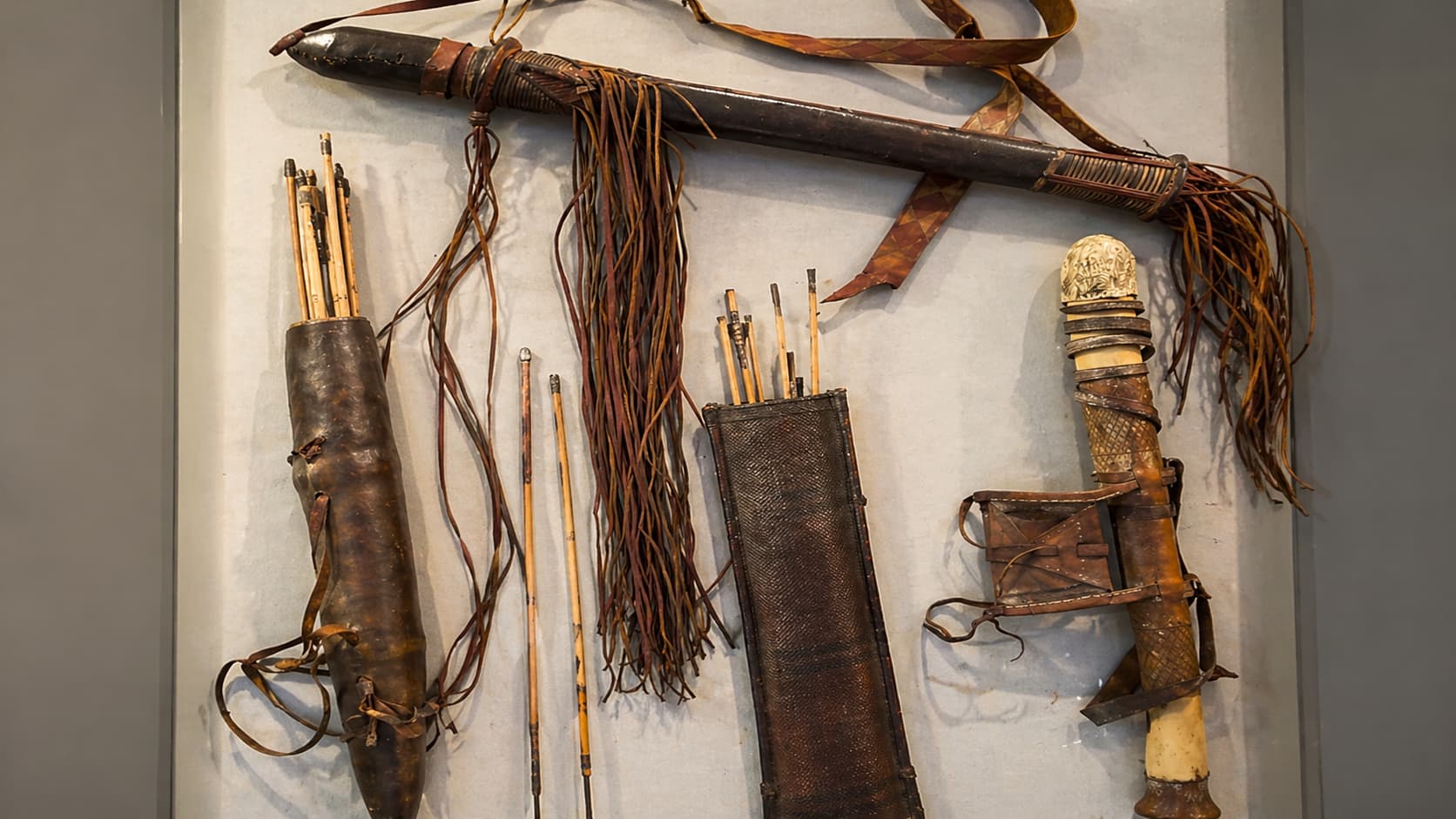Traditional arrows and quivers display at Terra Amata Museum in Nice, France showcasing prehistoric hunting tools