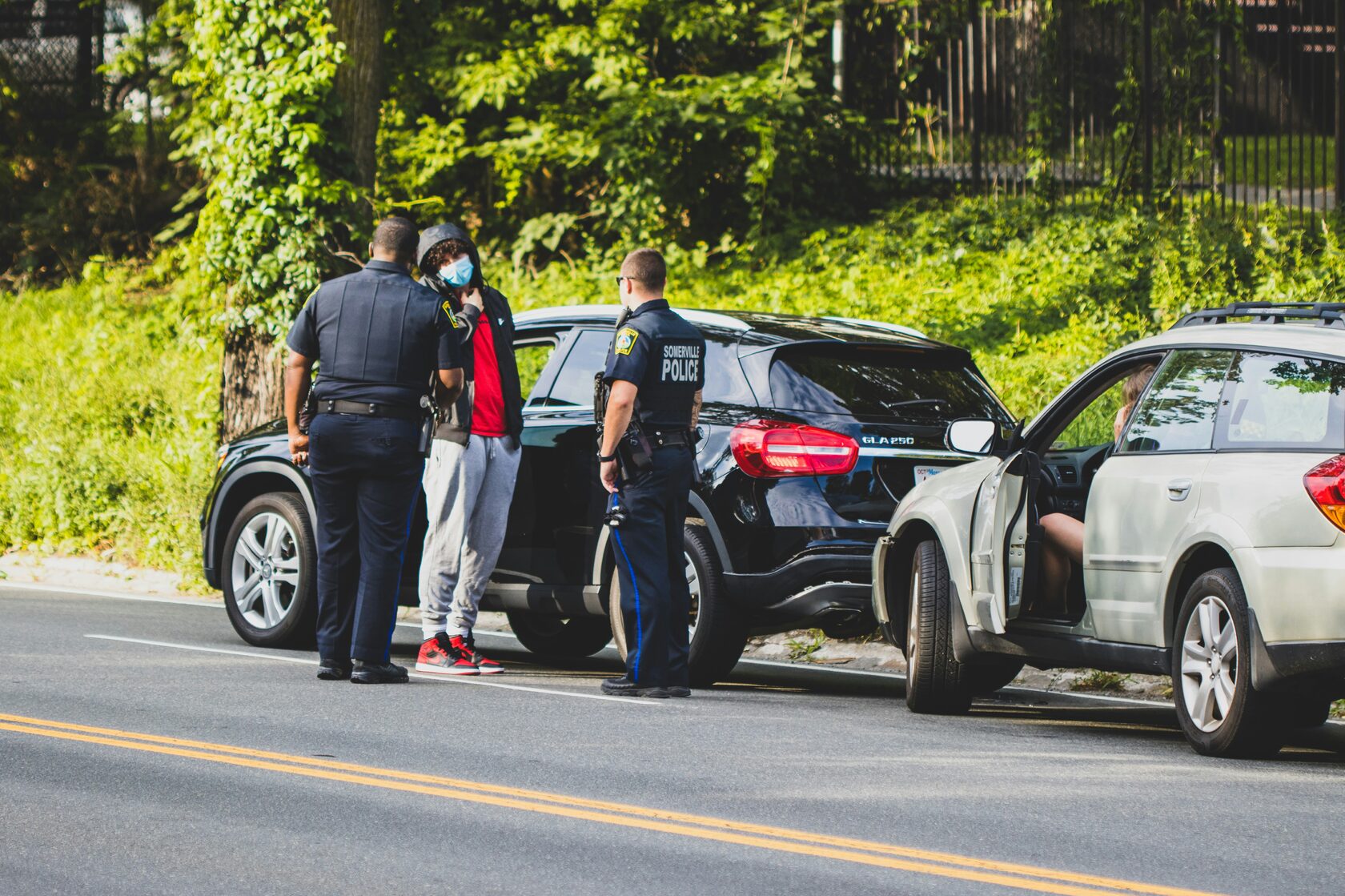 Rideshare vehicle accident scene with Uber or Lyft
