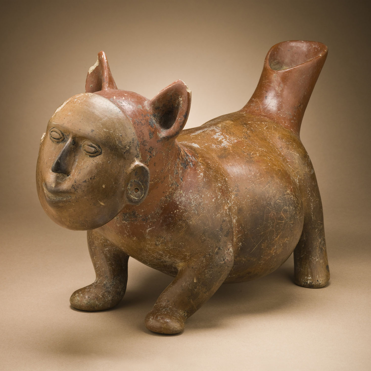 Собака с человеческой маской. Колима, 200 гг. до н.э. – 500 гг. н.э. Коллекция Los Angeles County Museum of Art.