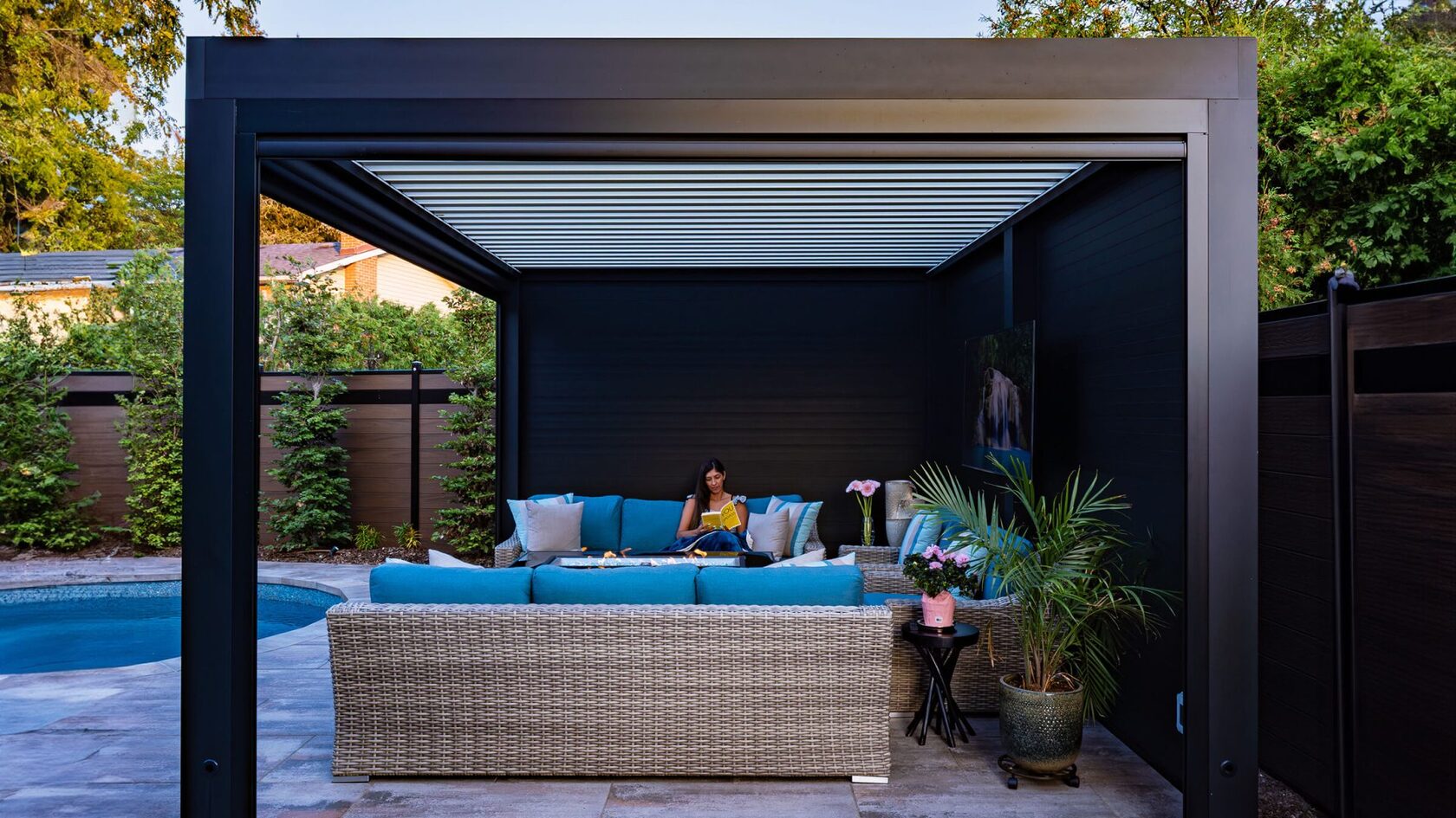Aluminum pergola with privacy walls and lounge seating