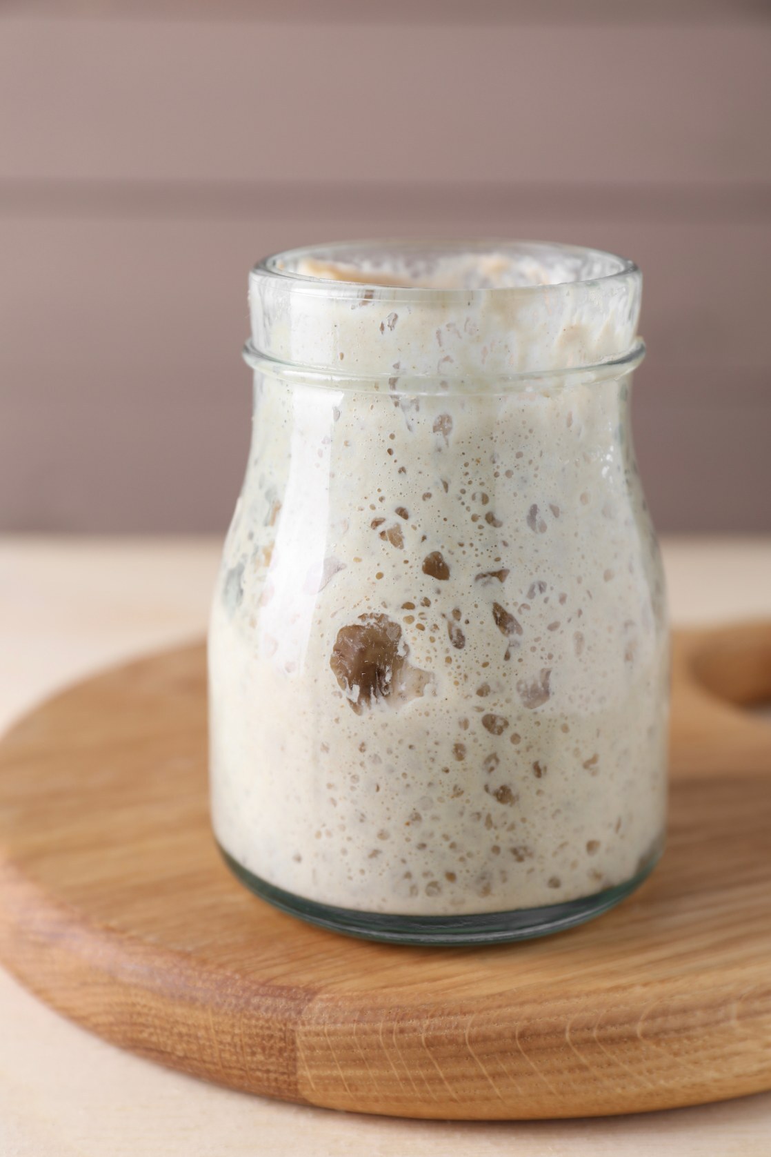Healthy active Levito Madre starter rising in a glass jar